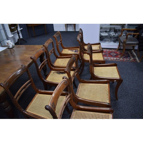 541 - A set of nine 19th century dining chairs with woven cane seats, turned back supports and sabre legs.