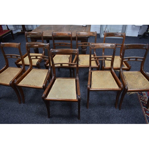 541 - A set of nine 19th century dining chairs with woven cane seats, turned back supports and sabre legs.