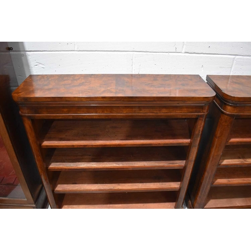 543 - A pair of Victorian flame mahogany four tier open bookcases, raised on plinth bases, 102cm by 105cm ... 