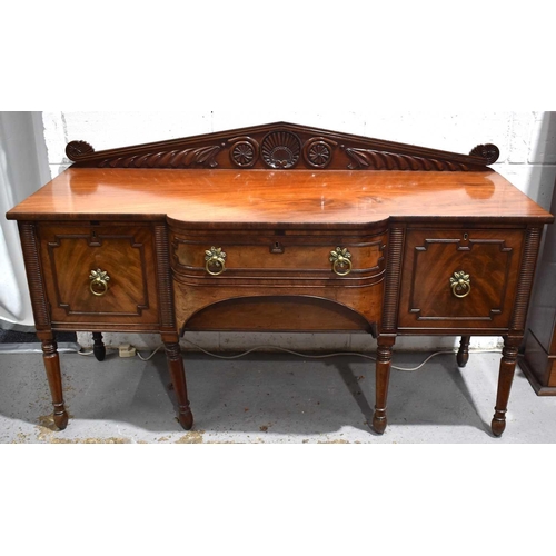 545 - A Regency mahogany breakfront sideboard, the central drawer flanked by a cupboard and cellarette dra... 