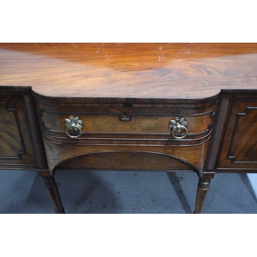 545 - A Regency mahogany breakfront sideboard, the central drawer flanked by a cupboard and cellarette dra... 