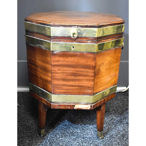 546 - A 19th century mahogany octagonal form wine cooler, with the original lead lined interior of compart... 