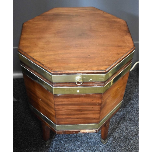 546 - A 19th century mahogany octagonal form wine cooler, with the original lead lined interior of compart... 