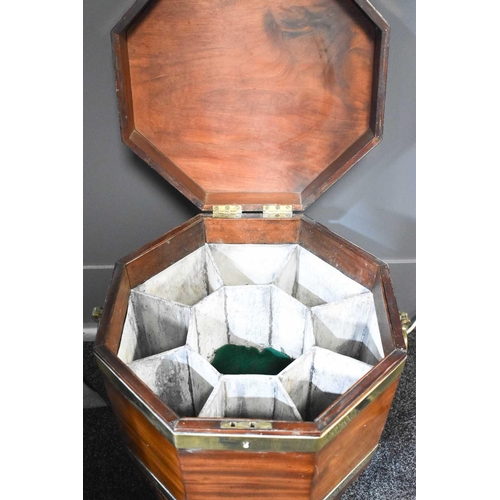 546 - A 19th century mahogany octagonal form wine cooler, with the original lead lined interior of compart... 