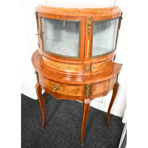 547 - A 19th century Louis XIV style French kingwood demi-lune vitrine, the single bow front door opens to... 