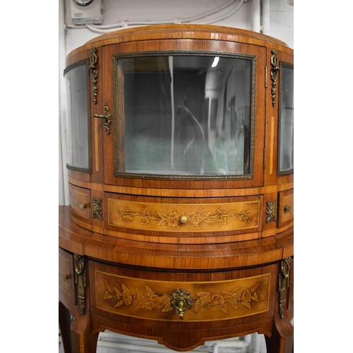 547 - A 19th century Louis XIV style French kingwood demi-lune vitrine, the single bow front door opens to... 