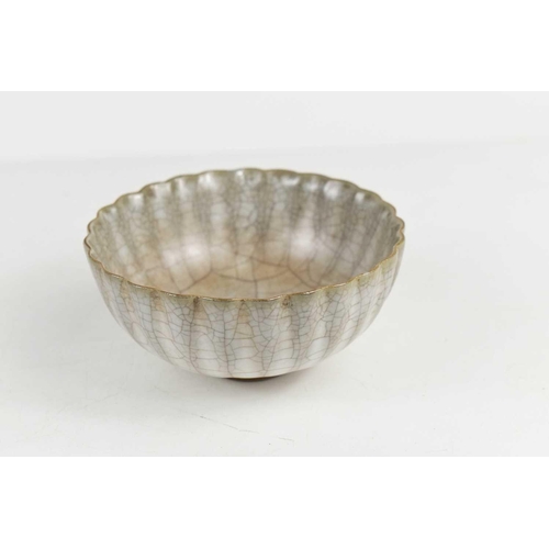 55 - A Chinese white celadon lotus bowl, early 20th century, with signature embossed to the base, 11½cm d... 