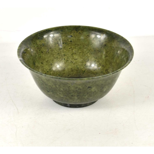 56 - A 20th century Chinese spinach jade bowl, 12cm diameter,