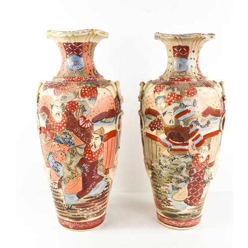 74 - A pair of Japanese stoneware glazed baluster vases, 20th century, depicting figures on a decorative ... 