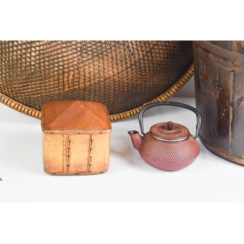 80 - A group of Chinese artefacts, including a tobacco canister, red painted metal tea pot, a large straw... 