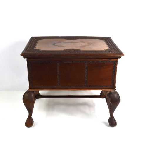 93 - An Indonesian hardwood casket on stand with intricately carved borders.