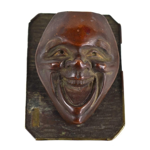 99 - A 19th century Chinese bronze patinated face mask paper holder, the back plate bearing signature in ... 