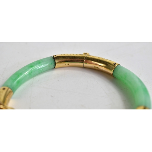 25 - An early 20th century Chinese gold and jade bracelet with articulated hinges made by Wang Hing of Ho... 