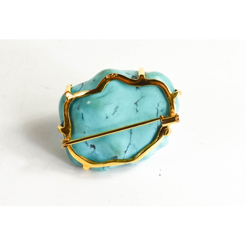 30A - A Chinese 14ct gold and polished turquoise brooch, 26g.