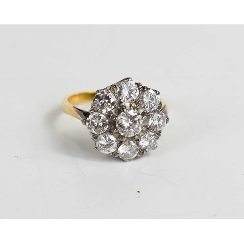 101 - An 18ct gold and diamond ring, the central brilliant cut diamond approximately 0.25cts, bordered by ... 