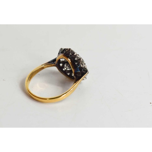 101 - An 18ct gold and diamond ring, the central brilliant cut diamond approximately 0.25cts, bordered by ... 