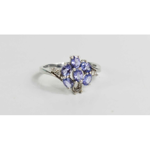 106 - A 14ct gold and amethyst cluster ring, composed of six oval cut amethysts (one missing), two diamond... 