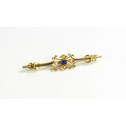 114 - A 15ct gold, sapphire and seed pearl bar brooch, each of the four pearls set in navettes, centred by... 