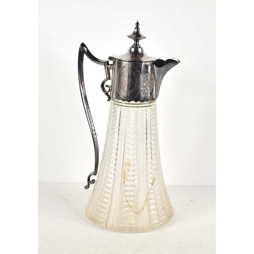 139 - A cut glass and silver plated claret jug, the mount decorated with foliage and having a vacant carto... 