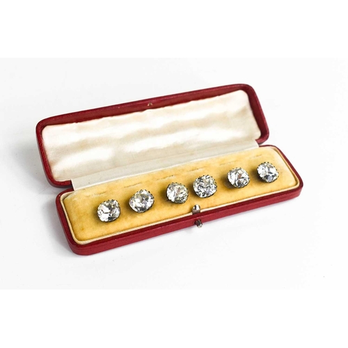 154 - A set of six white metal and paste buttons, in the original red leather presentation case.