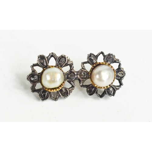 159 - A Georgian white metal and pearl brooch in the form of twin flowerheads, with the natural pearls in ... 