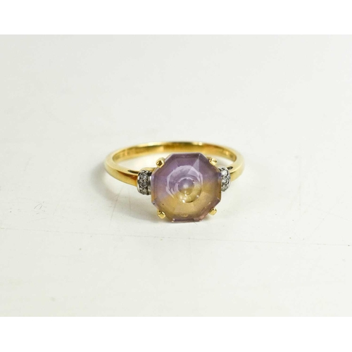 160 - A 9ct gold and ametrine ring, in four claw setting with brilliant cut diamonds set to the shoulders,... 