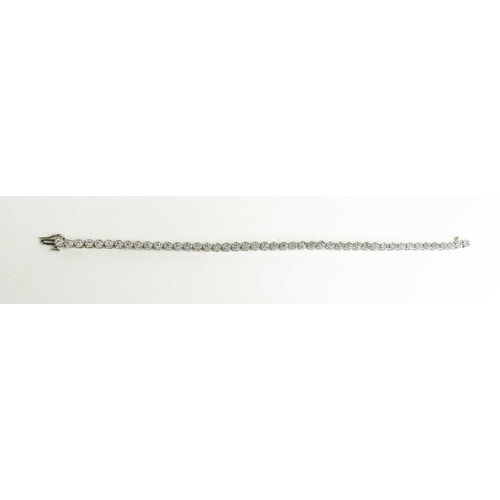 178 - An 18ct white gold and diamond tennis bracelet, each link comprising seven brilliant cut diamonds in... 