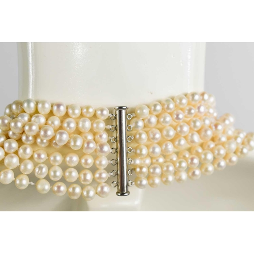 179 - A cultured pearl multi strand necklace, the waterfall form necklace composed of seven strands of pea... 