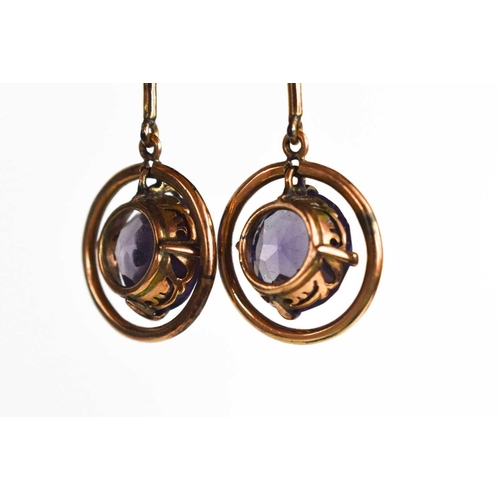 190 - A pair of 14ct gold and alexandrite drop earrings, with screw on backs, the brilliant cut alexandrit... 