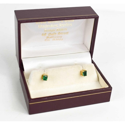 192 - A pair of 14ct yellow gold and emerald earrings, the rectangular cut emeralds approximately ½ct each... 