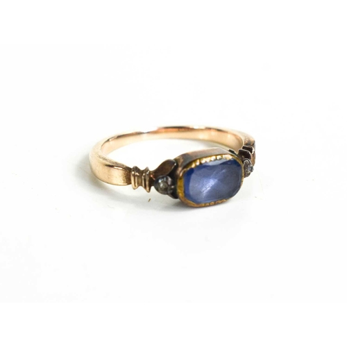 196 - A Georgian gold and blue paste ring, with foil back, and two flanking old cut diamonds, size L, unma... 