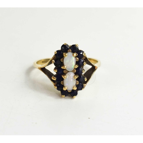 197 - A 9ct gold, opal and sapphire ring, the two oval opals bordered by brilliant cut sapphires and V-cut... 