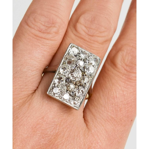 2 - An 18ct yellow gold and diamond ring, the rectangular platinum setting composed of fifteen old cut d... 