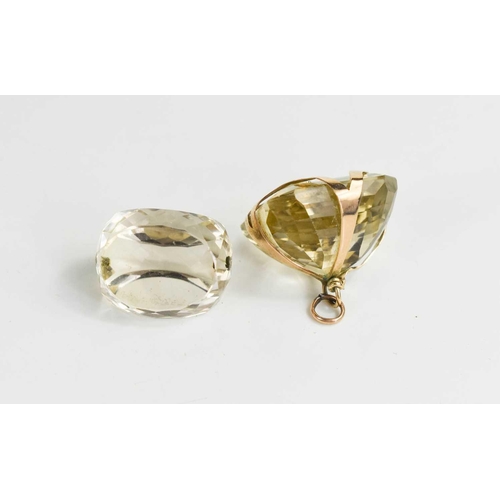 21 - A 14ct gold and pale citrine pendant, the cushion cut citrine 22 by 20mm, suspended from a hoop, tog... 