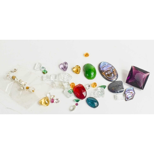 213 - A selection of loose gemstones, to include a heart form amethyst, topaz, mother of pearl, opal and o... 