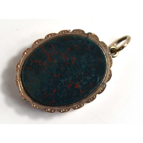 214 - A yellow metal agate and carnelian locket pendant.