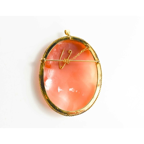 216 - A 14ct gold cameo brooch / pendant, carved in detail to depict a female profile portrait and flowers... 