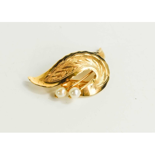 222 - An 18ct gold and pearl leaf form brooch, engraved with decoration, 6.34g.