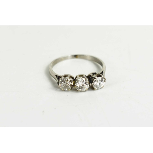 232 - An 18ct gold and diamond three stone ring, each diamond approximately ¼ct each, size M, 2.6g.