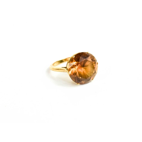 233 - A 9ct gold and citrine ring, the brilliant cut citrine approximately 6cts, in a six claw setting, si... 