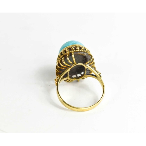 24 - A 14ct gold and turquoise cabochon ring, with a beaded border, size P, 8.19g.