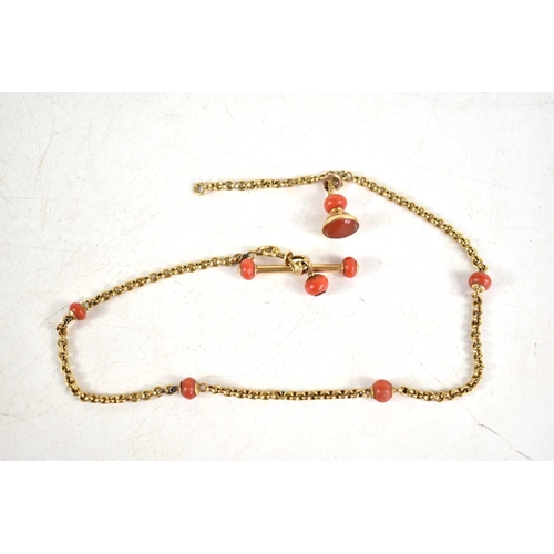 250 - An antique gold and coral Albert chain with a gold and carnelian fob, 14,2g.