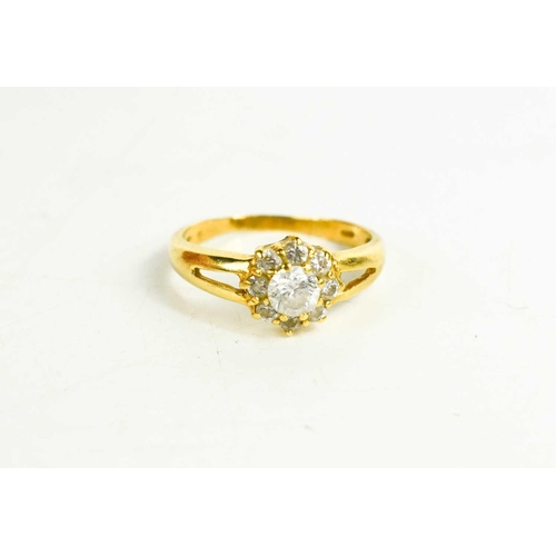 252 - An 18ct gold and cubic zirconia ring, of flowerhead form, size N/O, 3.26g.