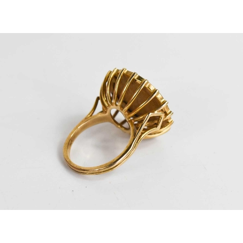 255 - A 1911 gold half sovereign set ring, in a basket form setting, size N, 9.64g.