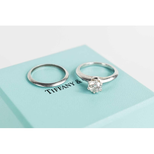 26 - A Tiffany & Co platinum and diamond solitaire ring, the brilliant cut diamond in a six claw setting,... 