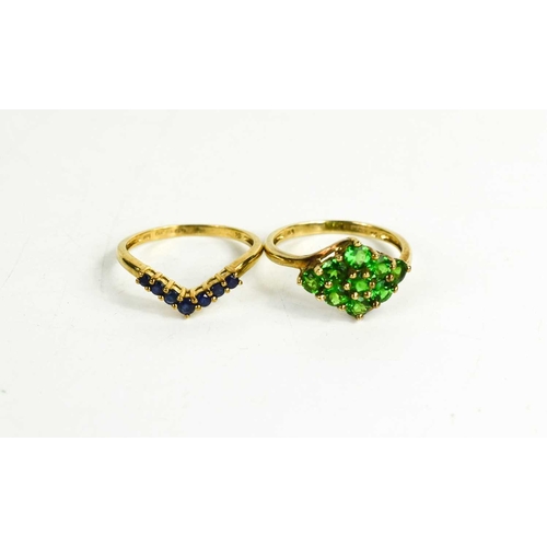 262 - Two 9ct gold rings; one of wishbone form, set with seven sapphires, size Q, and a green glass cluste... 