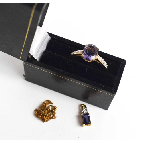 263 - A 9ct gold, amethyst and diamond ring, the oval cut amethyst set between diamond set shoulders, size... 