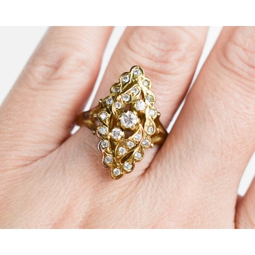 265 - A 14ct gold and diamond navette form ring, the variously sized brilliant cut diamonds in an openwork... 