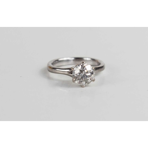 272 - An 18ct white gold, and diamond ring, the brilliant cut diamond approximately 1ct, with six claw set... 