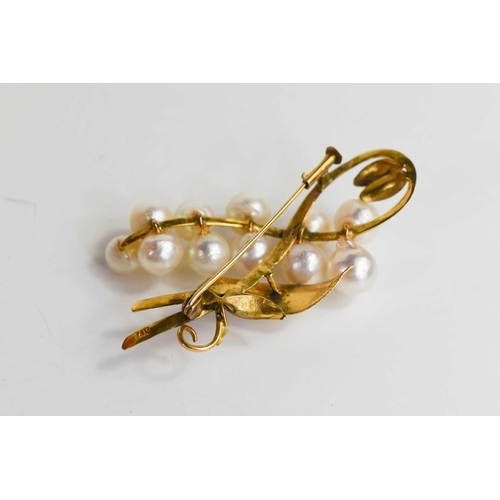 284 - A 14ct gold and pearl brooch, in the form of a spray of berries and foliage, 9.8g.